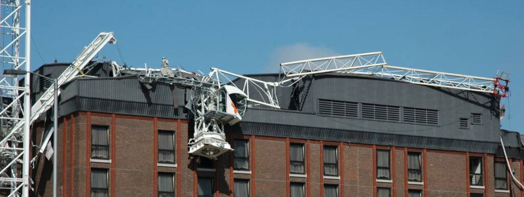 Fallen scaffolding on top of a brown building
